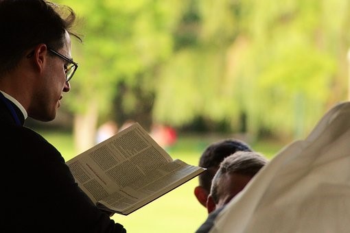 Image of a pastor reading a bible